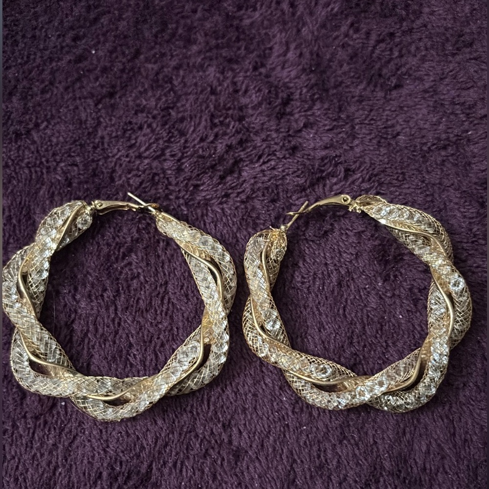 Gold tone with embellishments in clear hoop earrings